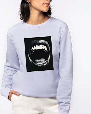 Model wearing a sweatshirt featuring a graphic of a high-contrast black and white open mouth