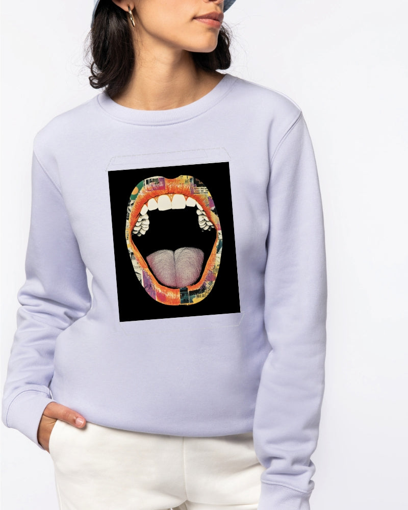 A person wearing a hoodie featuring an artwork of a stylized mouth with collage elements, making a bold fashion statement.